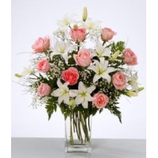 Floral arrangement in vase with white lilium and pink roses